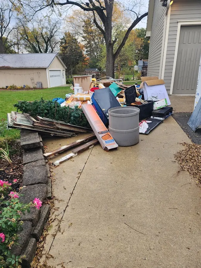Dumpster being loaded with debris for 12 Yard Dumpster Rental in Hamburg